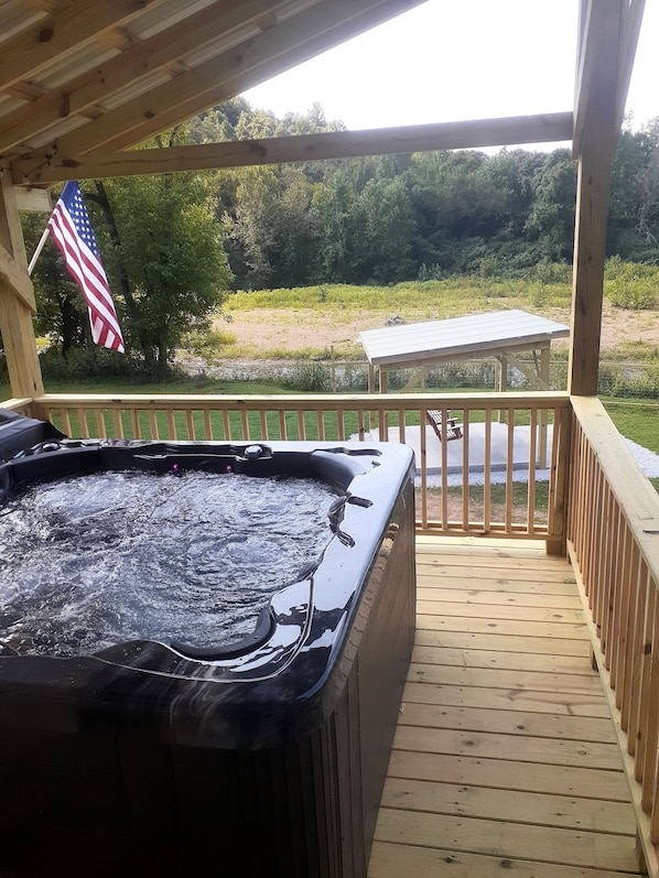 New jacuzzi overlooking the creek and swing porch 