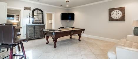 1st floor living room with pool table.  