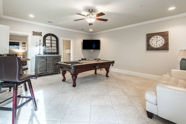 1st floor living room with pool table.  