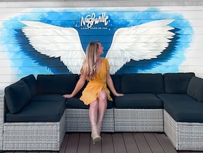 Enjoy getting a picture with your friends at the wings mural on the rooftop!