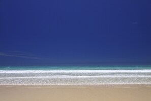 Clear blue skies and the warm, turquoise waters of the Indian Ocean.
 