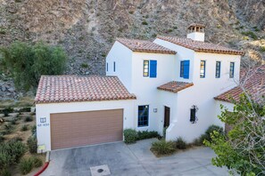 Nestled against the mountainside. Double garage.