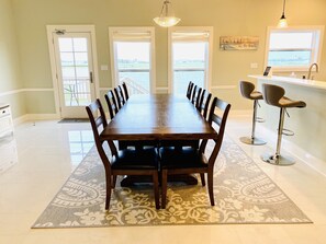 Large dining room table overlooking the waterview.