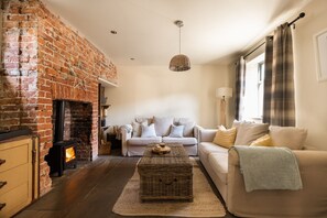 Cosy sitting room with woodburning stove for chilly evenings