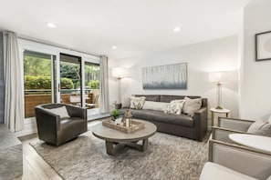 Spacious living room, with fireplace, RH king-size sleeper and heated floors. We also provide firewood for your convenience