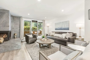 Spacious living room, with fireplace, RH king-size sleeper and heated floors. We also provide firewood for your convenience