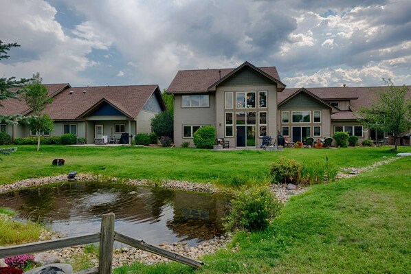 View of  Back of House and Patio with Grill and Seating