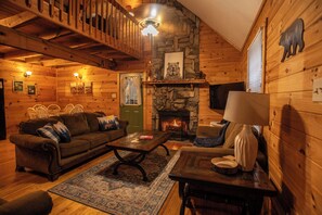 Cozy living room with a wood burning fireplace
