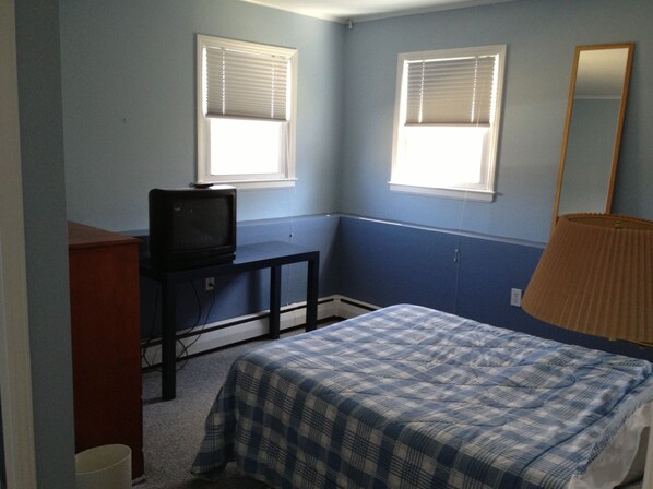 Bedroom with double bed and half bathroom in the room sink & toilet.