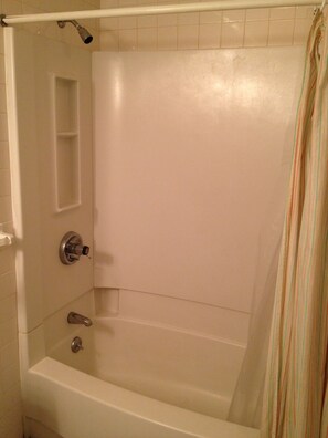 Lower level bathroom with shower, toilet and sink for use with blue room.