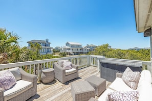 Porch at entry of home with comfortable seating