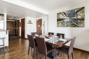 Dining room with hardwood floors, rectangle bronze dining room table with seating for 6