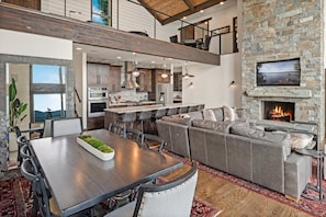 Dining and living area in a great room concept with soaring ceilings.
