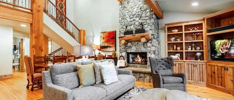 Spacious living room with a fireplace to relax after a long day of Park City fun