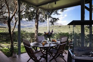 Enjoy al fresco dining on the terrace overlooking nature.