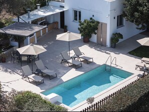  Lounge by the pool, taking in the panoramic views of Crete’s countryside.