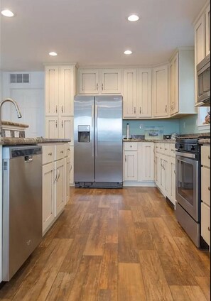 Open kitchen, living and dining area seats 10. 