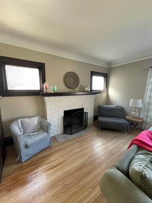 living room with 2 chairs and great natural light