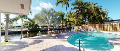Relax by the pool on our lounge chairs or enjoy an outdoor meal on the water!