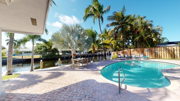 Relax by the pool on our lounge chairs or enjoy an outdoor meal on the water!