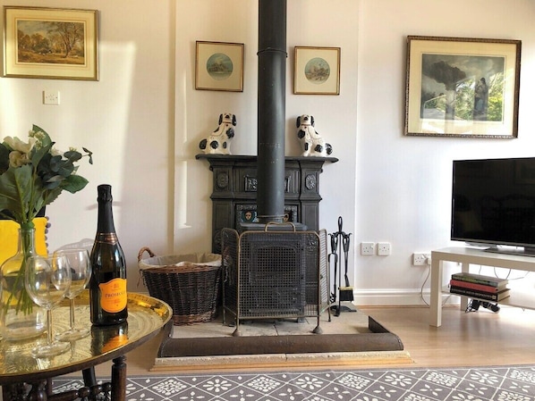 Log burning stove, bag of wood and kindling provided.