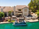 Enjoy stunning sunset views from this beautifully decorated waterfront property 