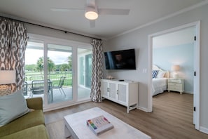 Sliders lead out to the deck and features beautiful golf course views.
