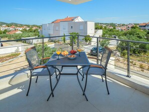 Sky, Plant, Table, Building, Plant Community, Furniture, Shade, Outdoor Furniture, Chair, Outdoor Table