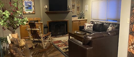 Our very cozy living room area, with a wood burning fireplace!