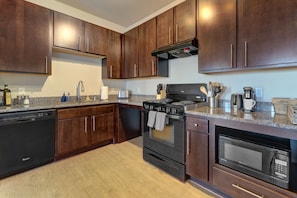 Large countertops and elegant cabinetry make cooking a joy