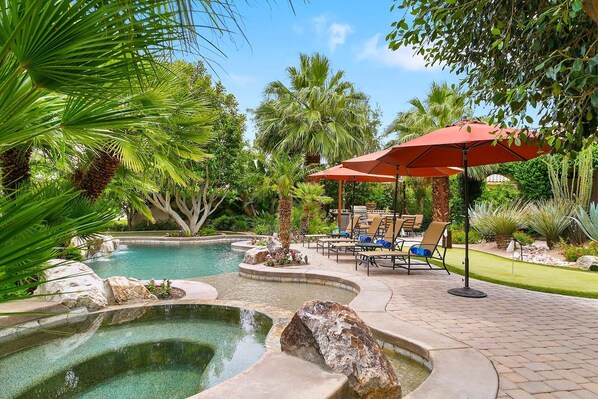 A tropical oasis of mature plantings - hibiscus, citrus, bird of paradise and palms