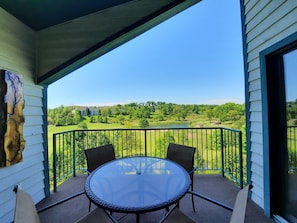Full-sized patio table & chair set! This condo has the best view of the Greens!
