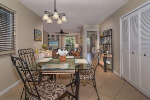 View from the dining area into the living room with large dining table