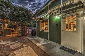 Across from the main house, the guesthouse is a separate domicile with two attached stalls for your horses.