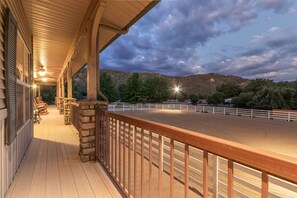 Stellar views of the lighted, groomed, 90 x 120 foot riding arena from deck of main house.