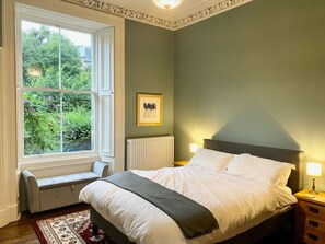 Main bedroom - Kingsized bed Original shutters, cornicing and fireplace