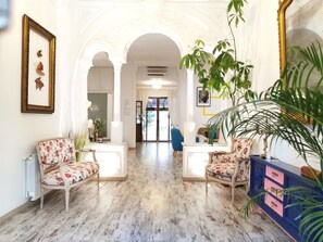 Entryway with original feature archway of this 120+ year old home