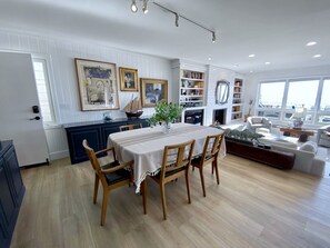 Downstairs open-concept dining area and lowered living area for entertaining