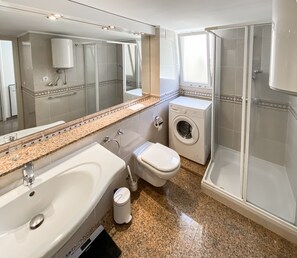 Spacious bathroom with washing machine