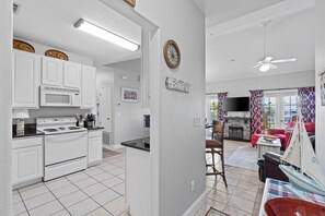 Foyer looking into kitchen and living area