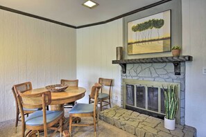 A dining table rests in the corner, perfect for board games!