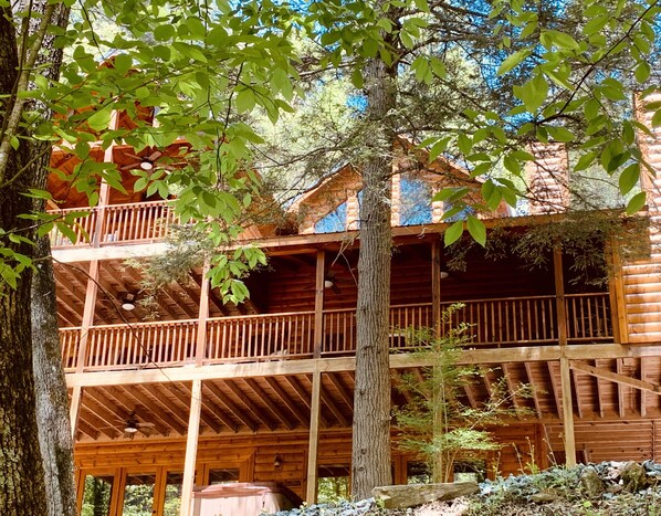 Front of cabin facing river w/ wrap around porch.  Perfect for viewing wildlife.