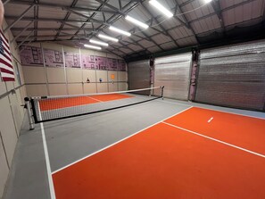 Fun Size pickle ball. The small white lines are for cornhole with Dolly.