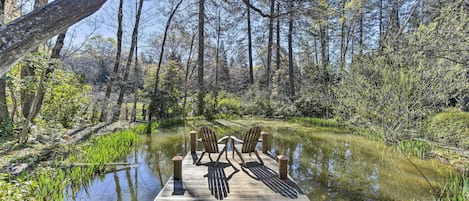 This vacation rental boasts a dock and koi pond.