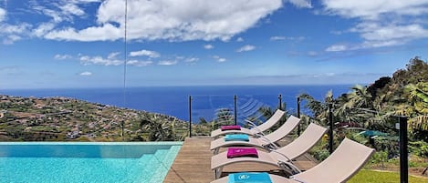 Seamless infinity pool, ocean vista—paradise found in Ribeira Brava's #poolview #sunloungers #oceanview