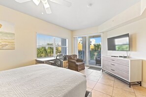 Primary bedroom with balcony access.