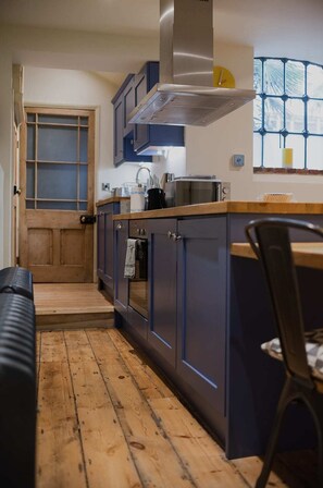 Large kitchen fully equipped with all you need to dine in. Also provides a great space to work from.