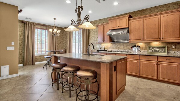 Fully appointed kitchen with open-floor plan.