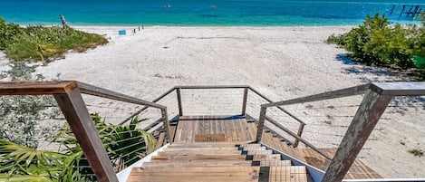 Walk out your front door for toes in the soothing sand on your private beach.