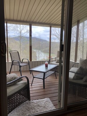 Covered, screened in back deck with Lake Views